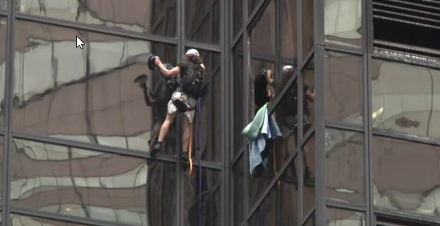 Watch Man Trying To Scale Trump Tower With Suction Cups